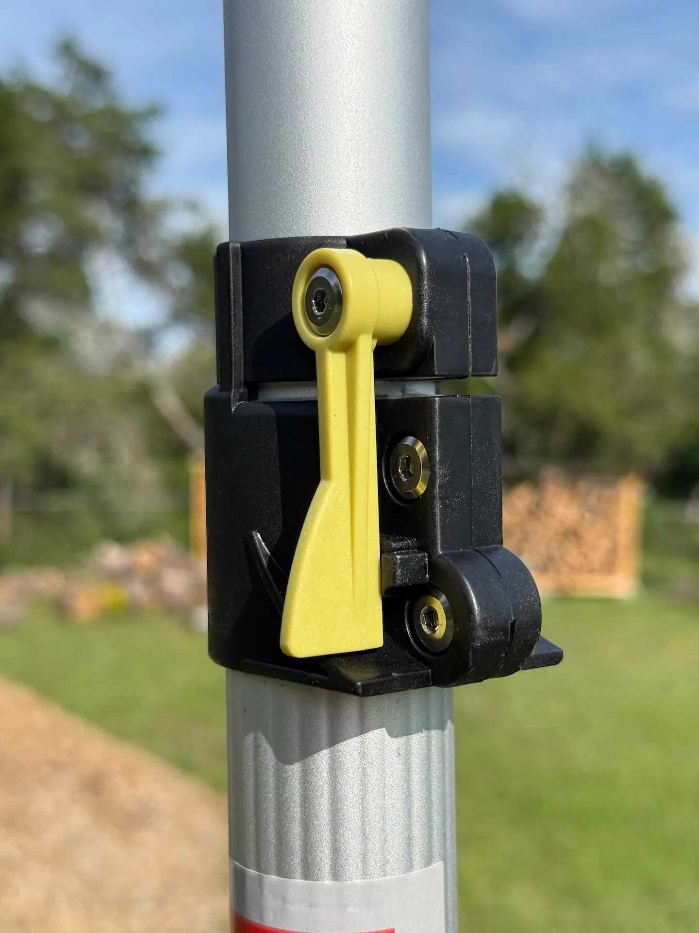 Close-up of the DOCAZOO DOCA pole's aluminum lever-lock mechanism