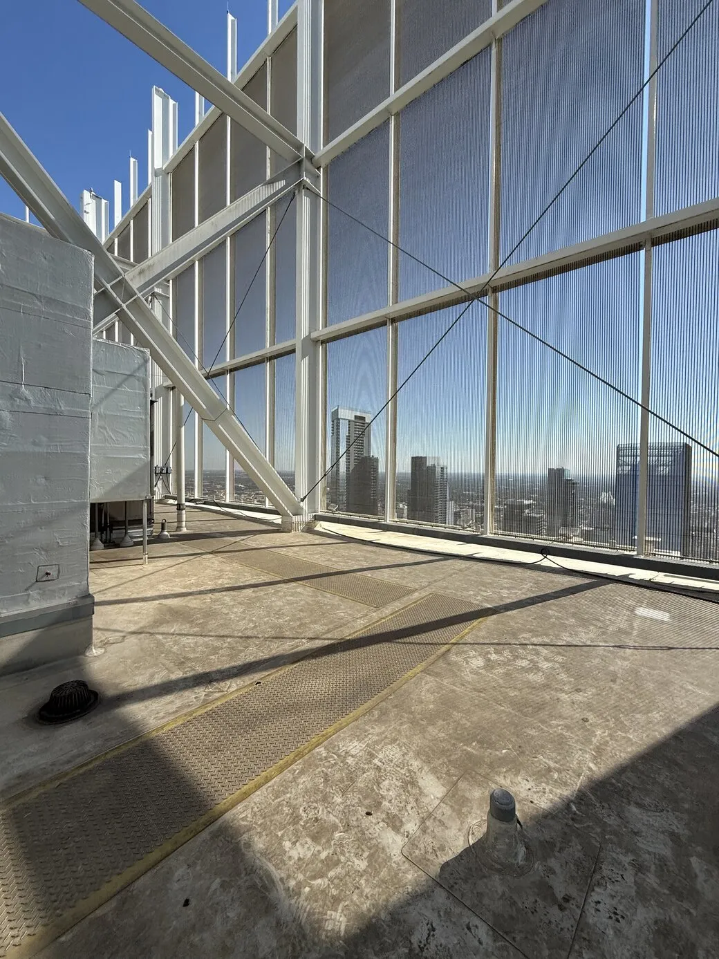 Rooftop of The Independent Condos showing part of the rooftop and part of the city skyline