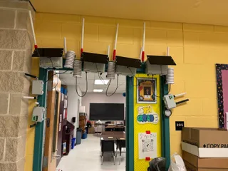 A bunch of nodes for the AISD Mesh Learning Initiative around a classroom door