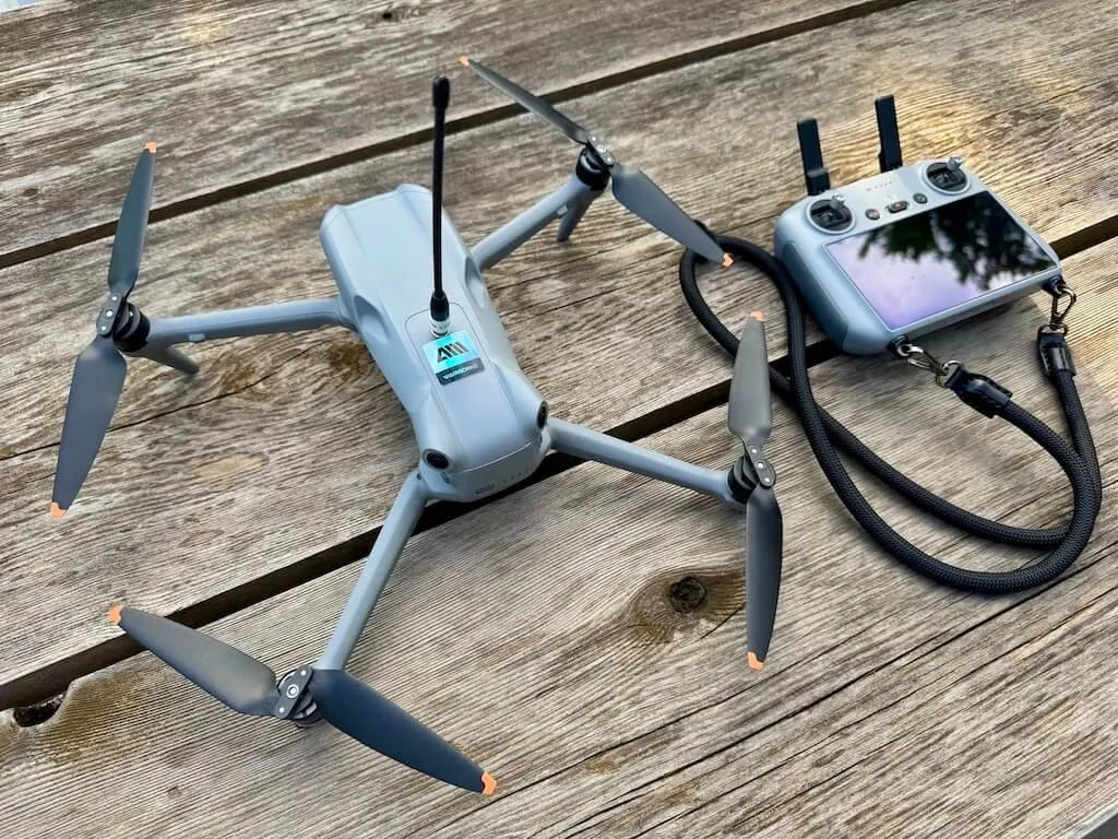 The completed DJI Air 3 mesh-node build alongside its controller, ready to fly