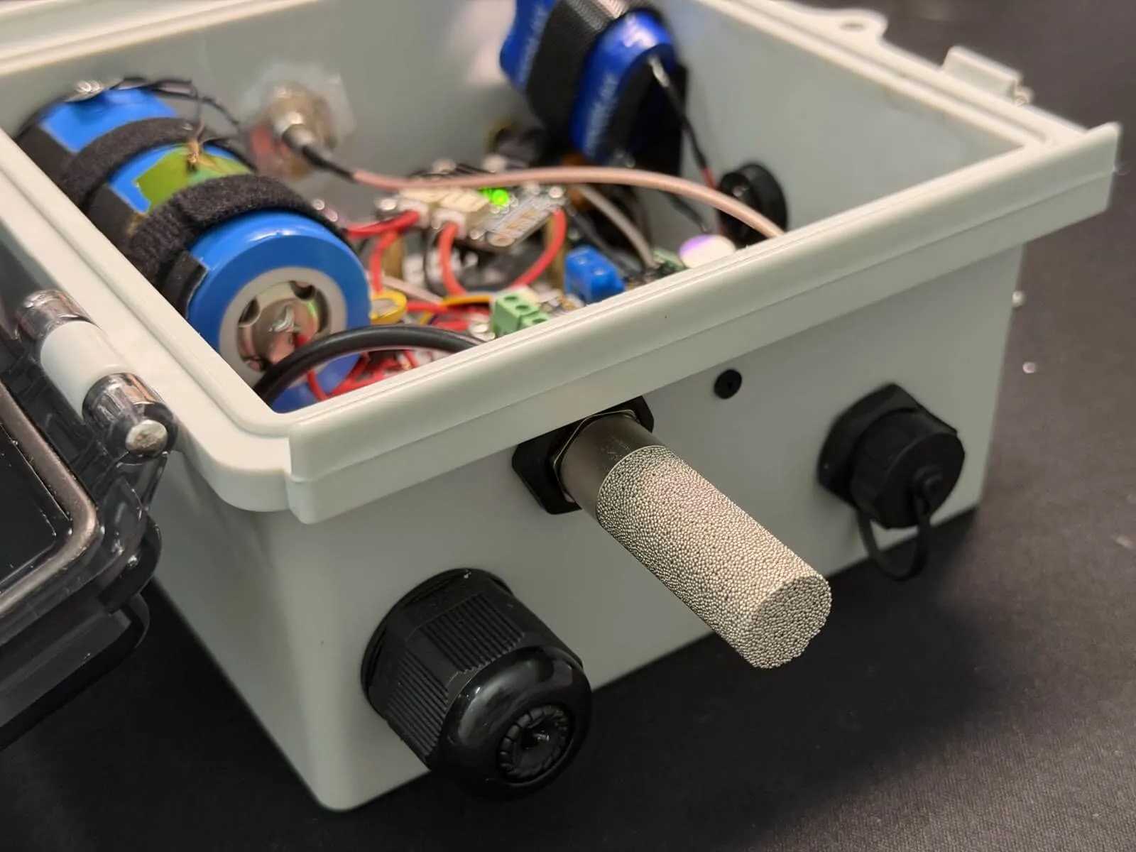 Sintered SHT45 temperature and humidity sensor mounted outside the repeater enclosure