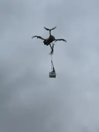 LilyGo T-Echo node hanging from a drone